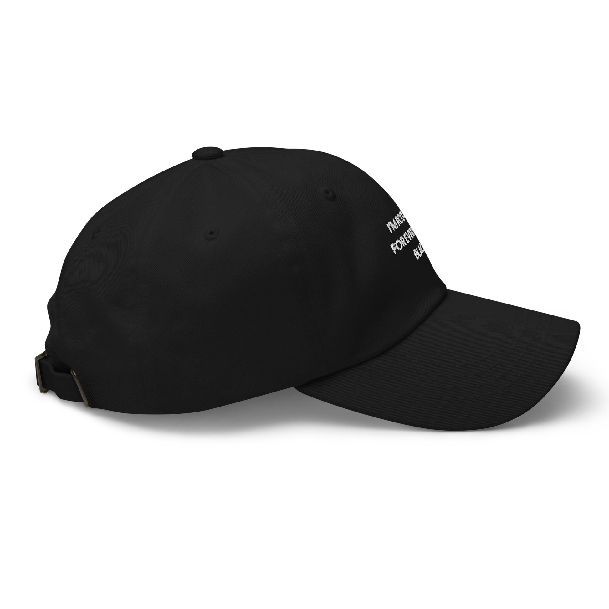 Side view of black baseball cap with black empowerment phrase embroidered in white font.